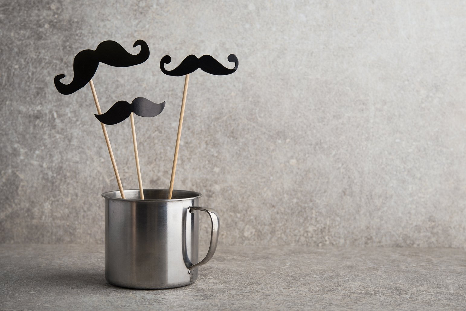 Black photo booth mustache in a cup